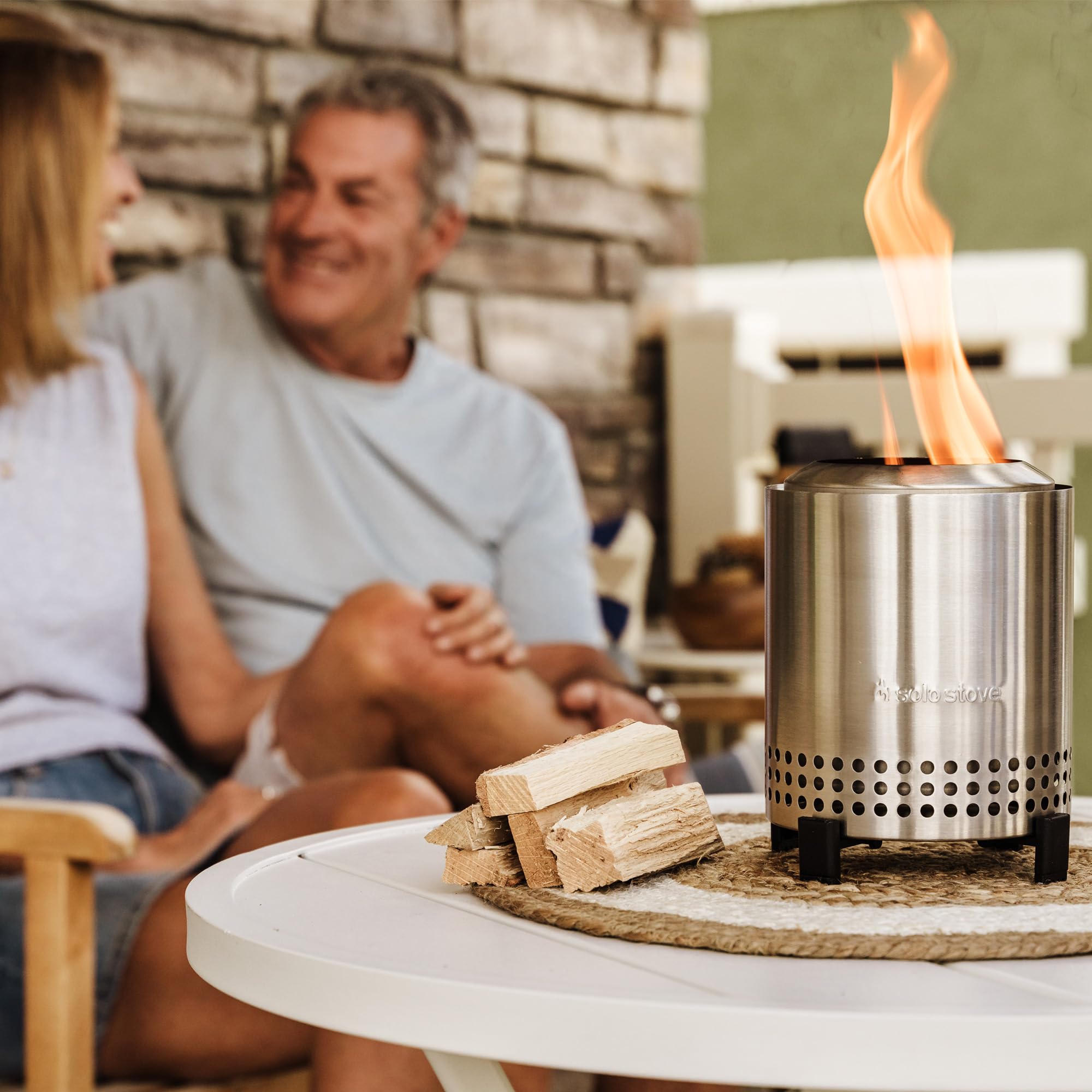 Solo Stove Mesa next to hand illustrating 1.4 lb lightweight portability