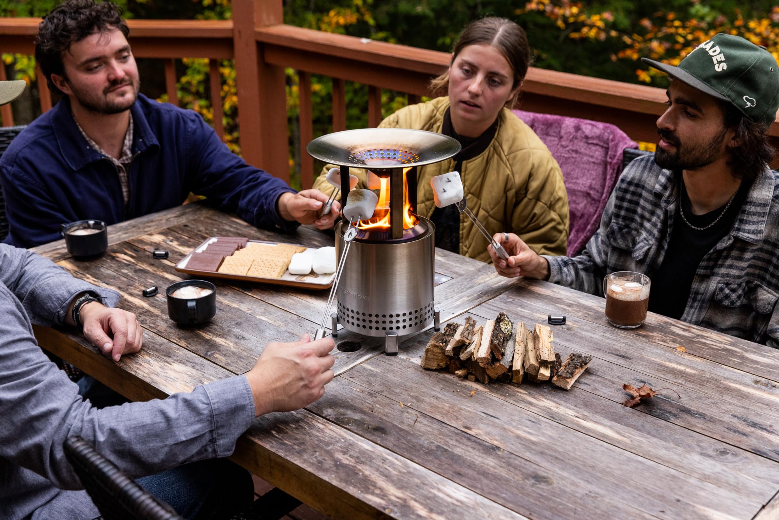 Solo Stove lifestyle scene with friends enjoying redirected warmth outdoors