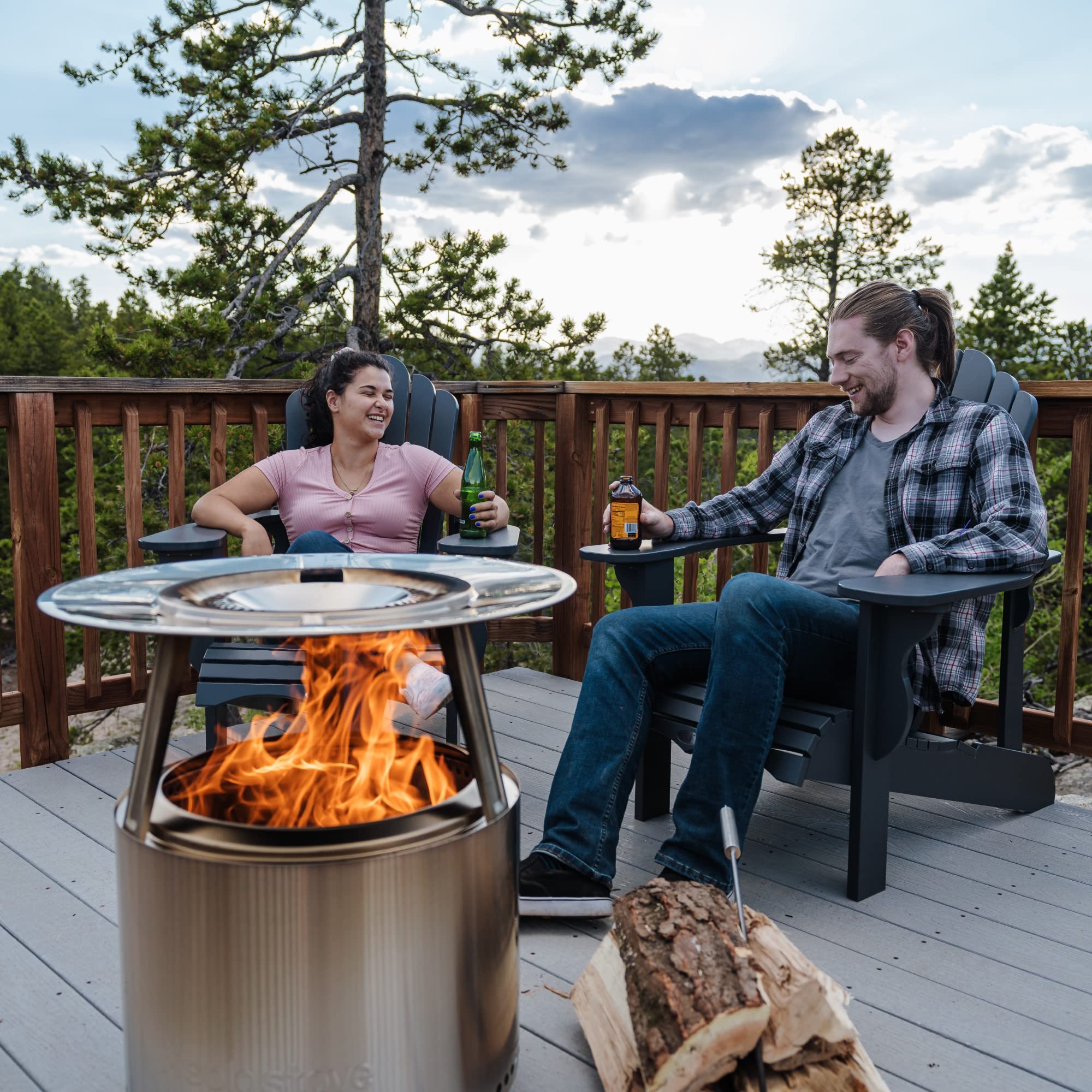 Solo Stove heat deflector in backyard scene increasing comfort for group