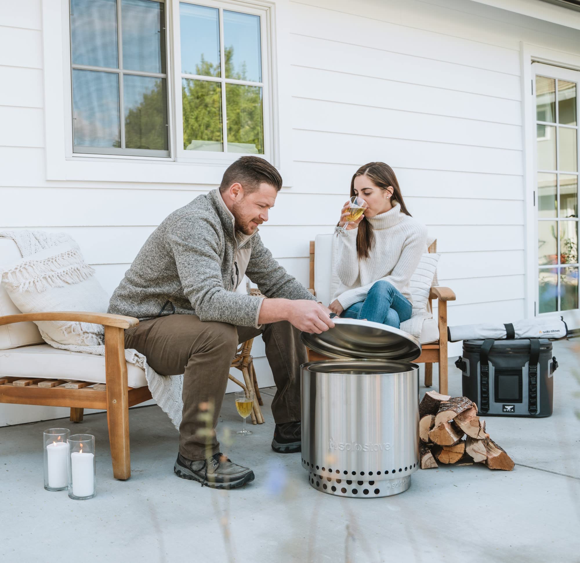 Solo Stove Ranger Lid next to a hand showing size and easy handling benefit