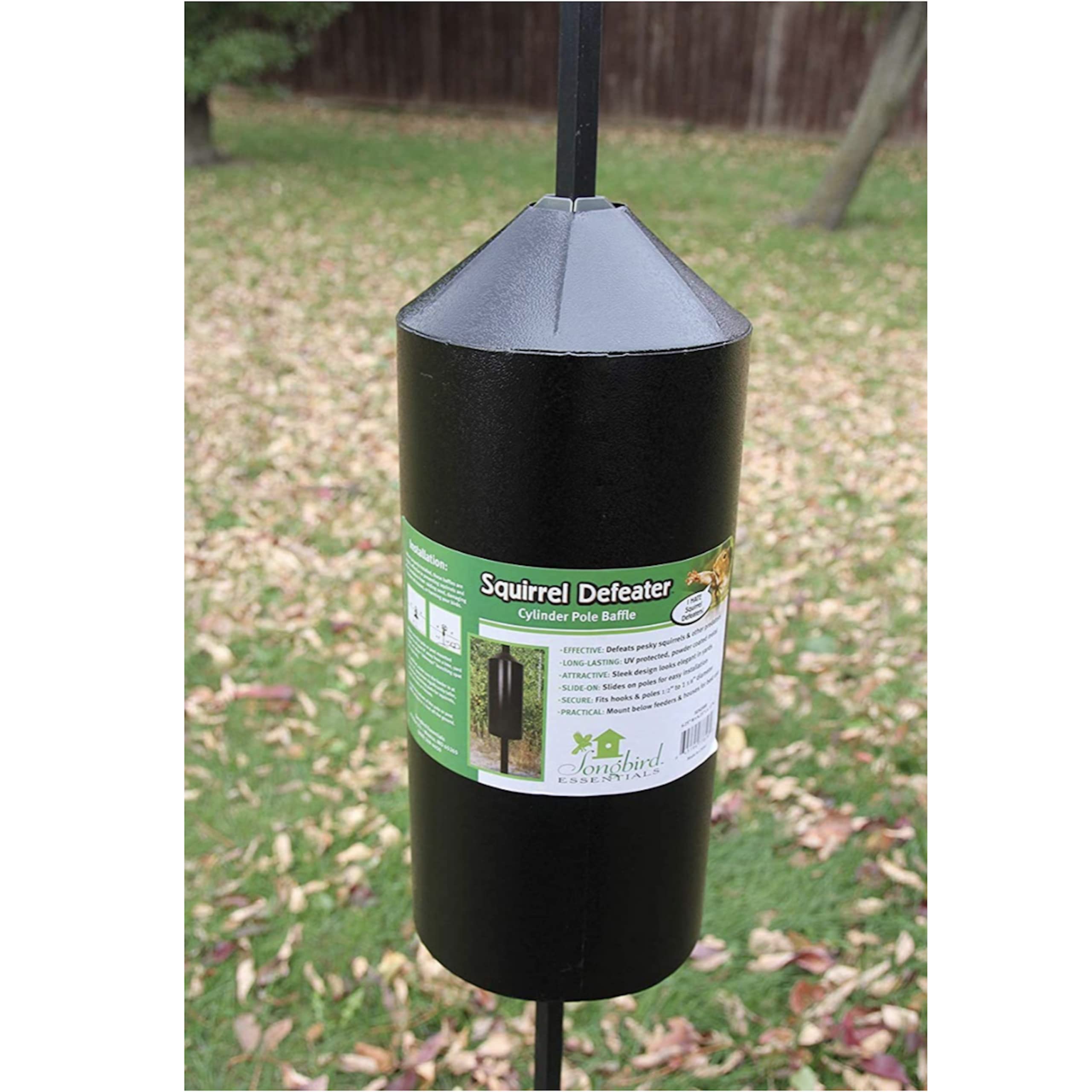 Songbird Essentials backyard lifestyle scene showing protected feeders