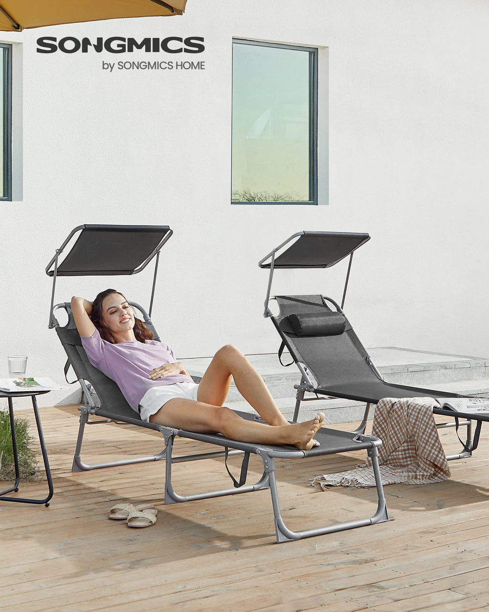 SONGMICS folded sun lounger compact profile with carry handle for easy transport