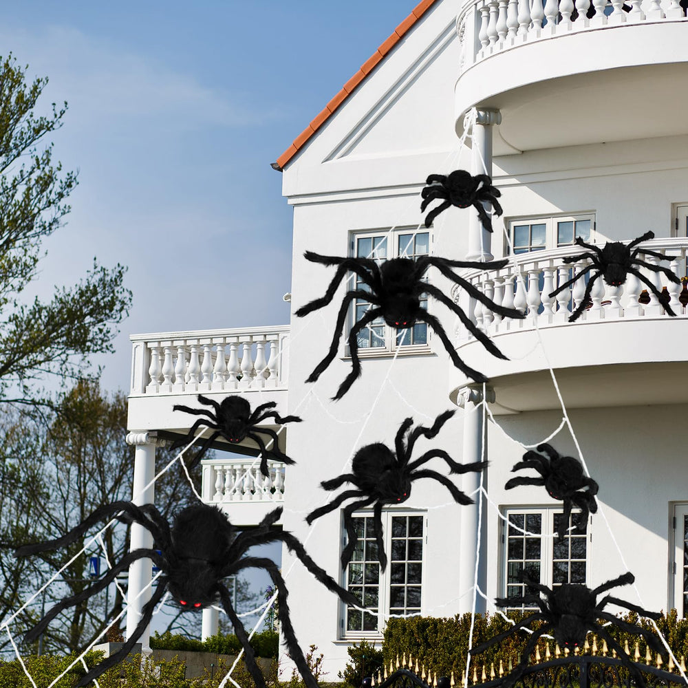 Sosation spiders arranged in tree and lawn display showing realistic outdoor staging