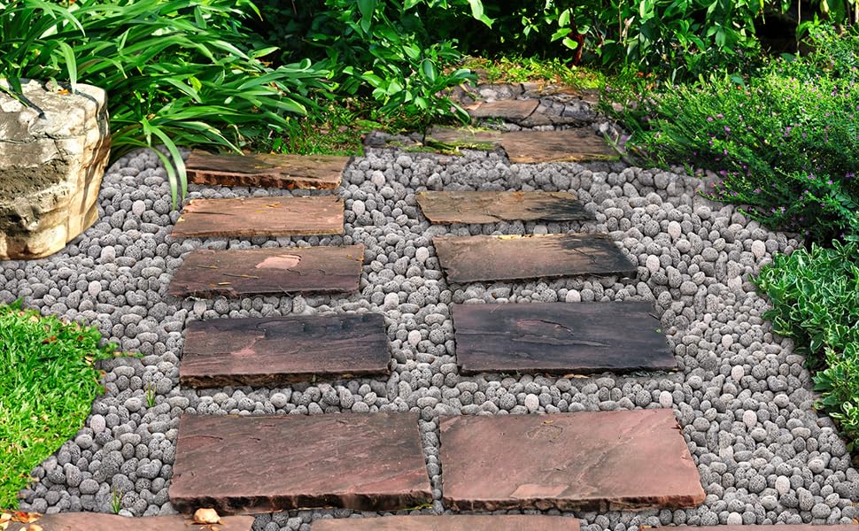 SOUJOY backyard fire pit at dusk with stones providing warm ambience benefit