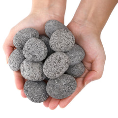 SOUJOY lava rocks arranged in a fire pit demonstrating even flame dispersion benefit