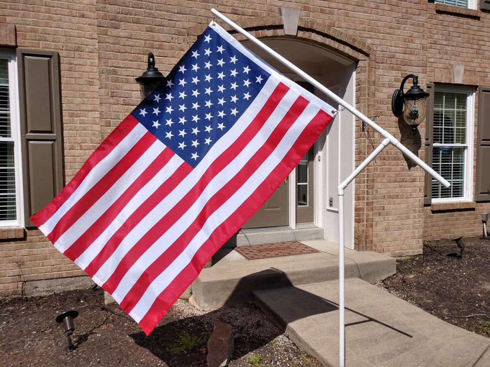 Spinner Flag next to a chair for size comparison and easy transport