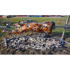 SPITJACK whole-animal roast on rotisserie with shackles for stable cooking