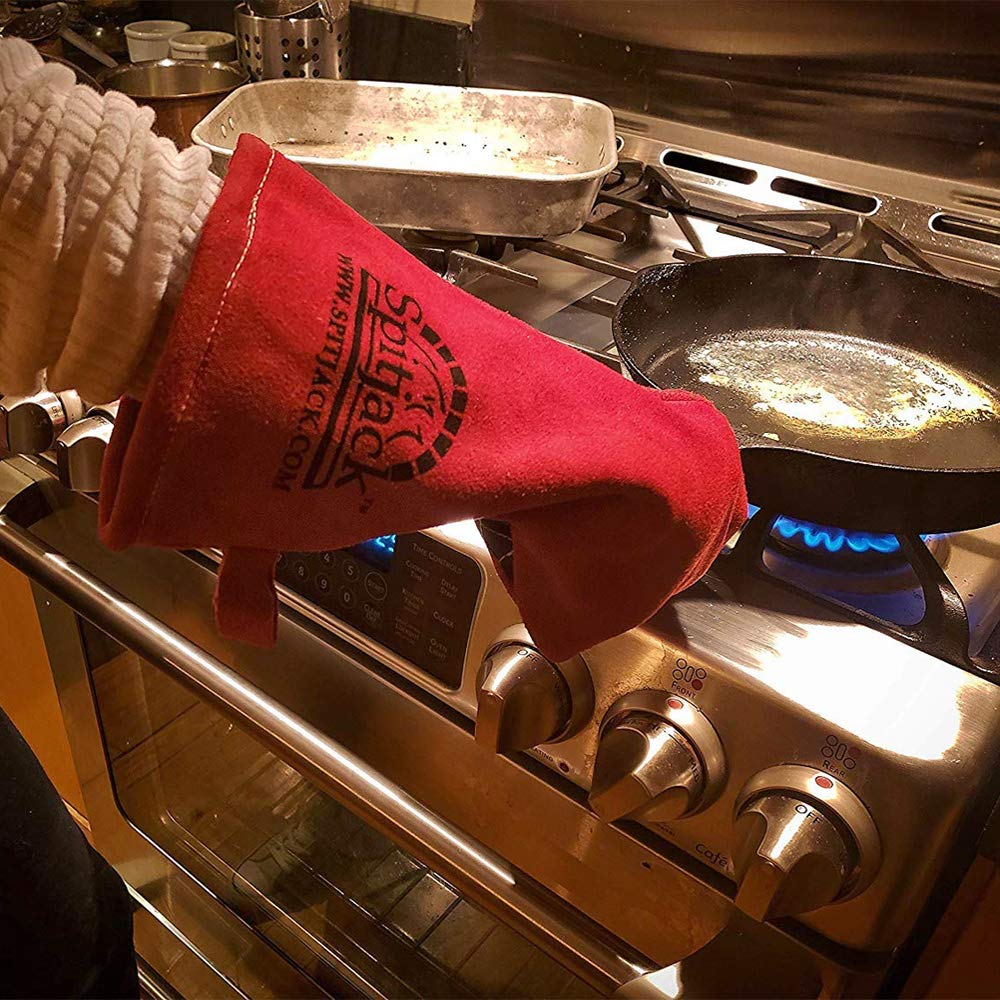 SPITJACK gloves on hand size comparison showing full-coverage cuff and secure fit