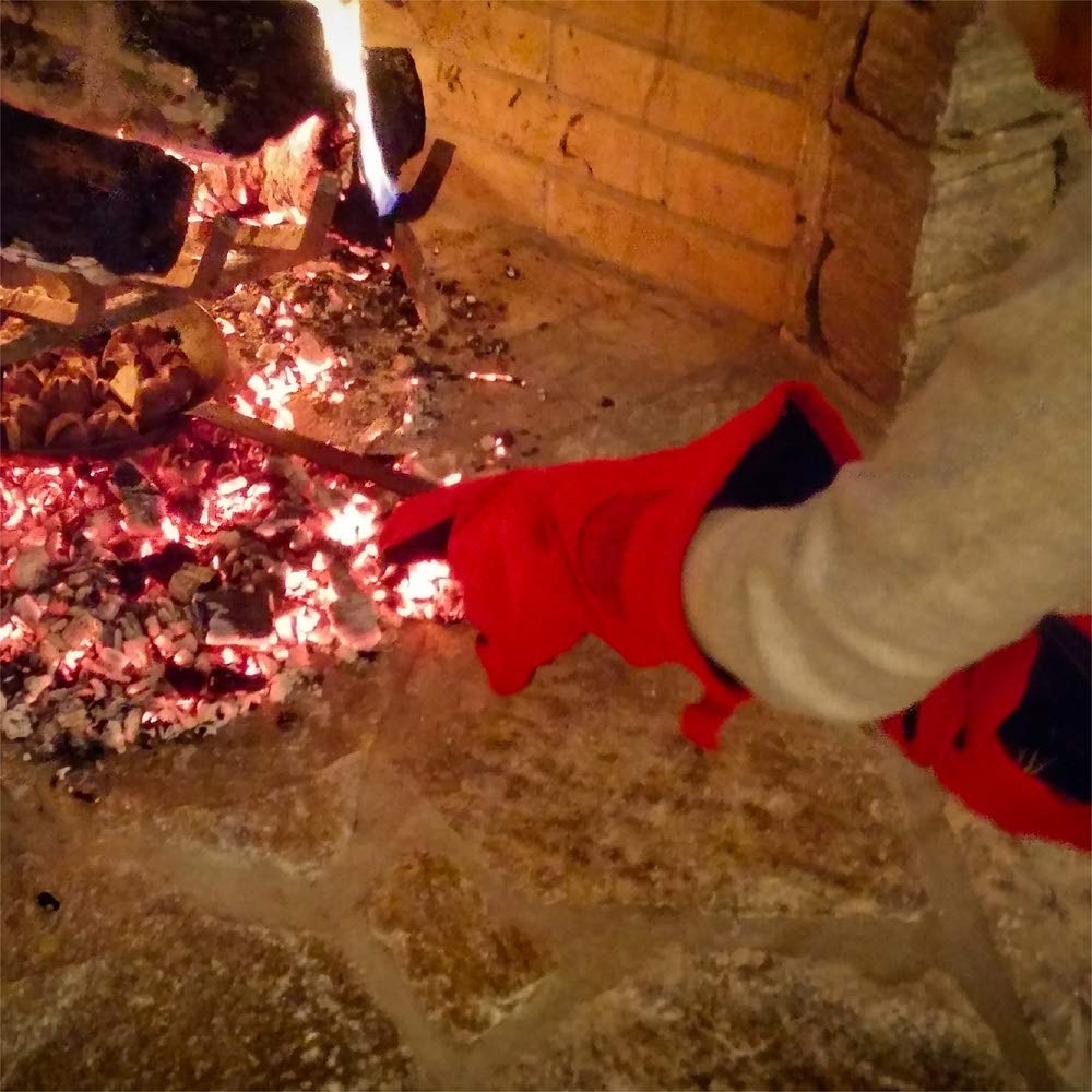 SPITJACK gloves beside fireplace tools showing safe tending and short-term ember handling