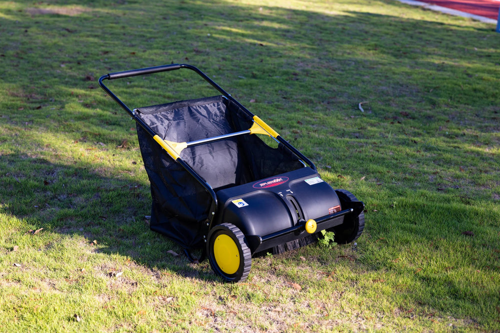 SPLENDOR in use sweeping a lawn showing fast cleanup benefit