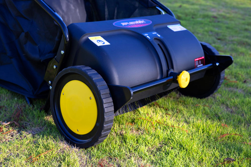 SPLENDOR next to garden rake showing 21-inch width for efficient coverage benefit