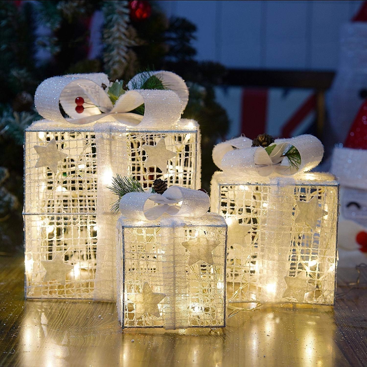 SPRKLINLIN front view of three lit gift boxes, creates warm festive ambiance