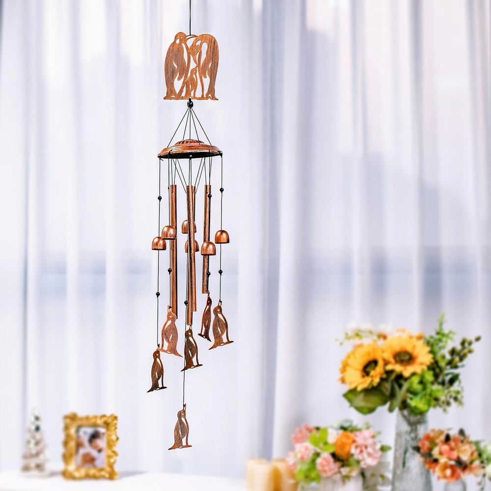 SRDJXY penguin chime in a garden setting adding whimsical decor and gentle sound