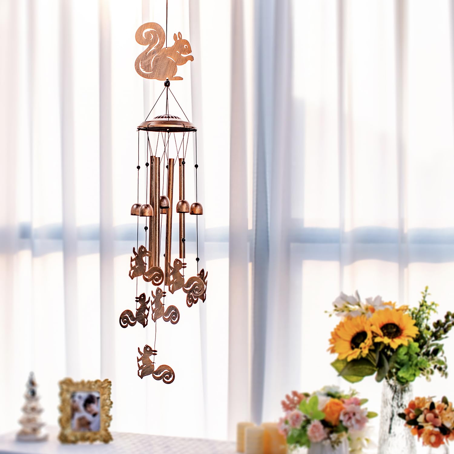 SRDJXY chime amid garden plants enhancing outdoor ambiance
