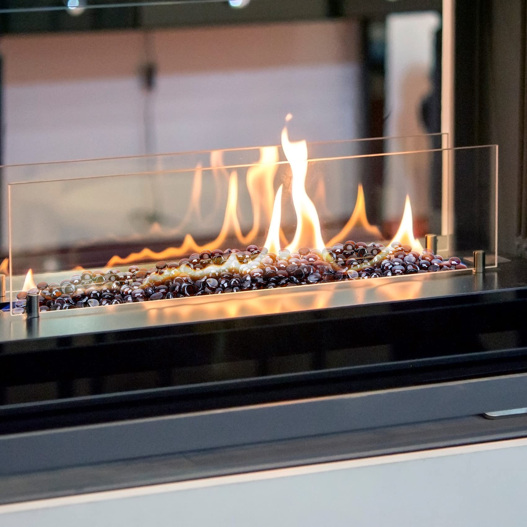 Stanbroil amber glass used in indoor fireplace creating warm glow