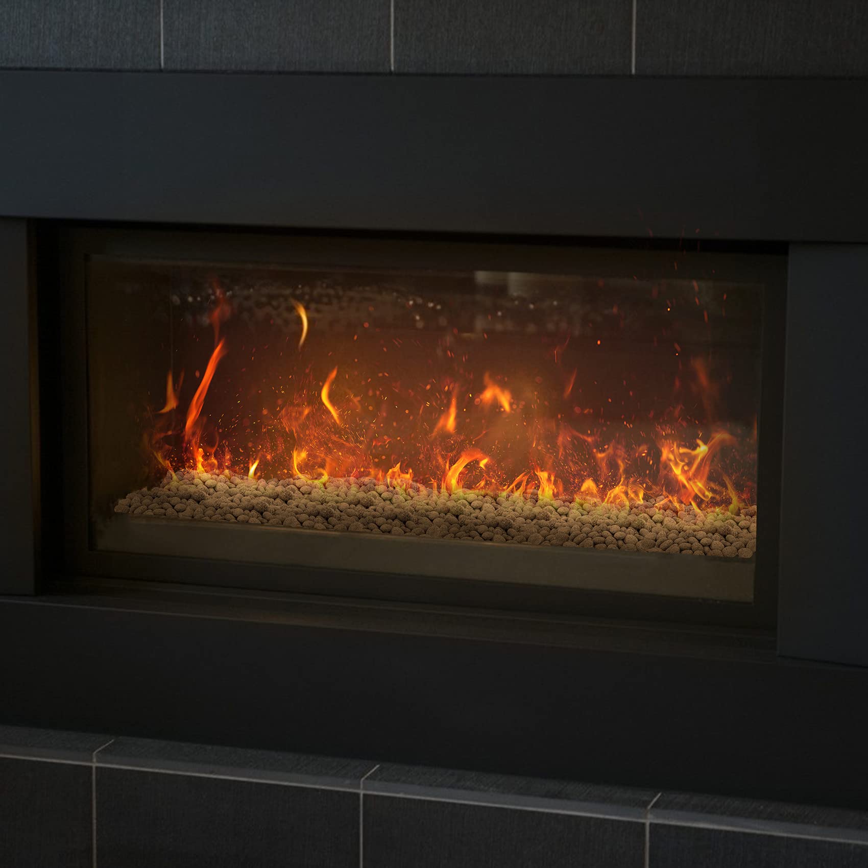 Stanbroil lava rock evenly spread across burner demonstrating coverage benefit