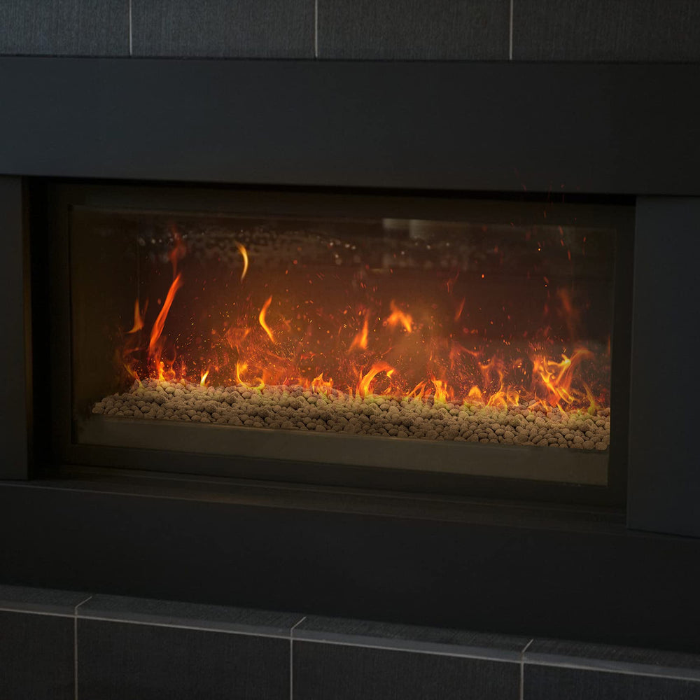 Stanbroil lava rock evenly spread across burner demonstrating coverage benefit