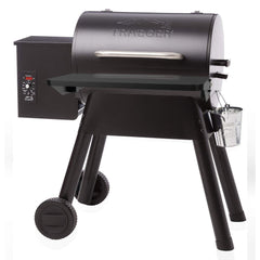 Stanbroil shelf folded flat against grill showing compact storage and cover compatibility