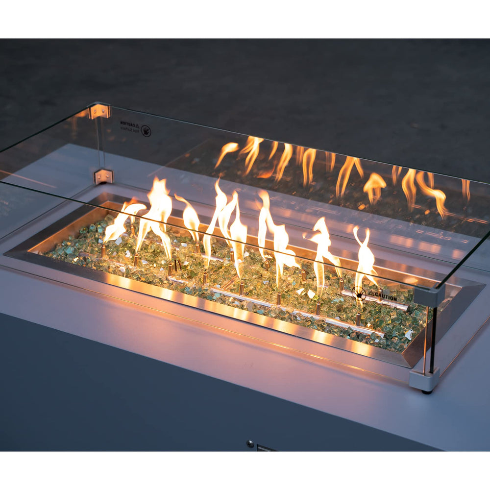 stanbroil glass spread over burner pan demonstrating safe placement and even flame flow