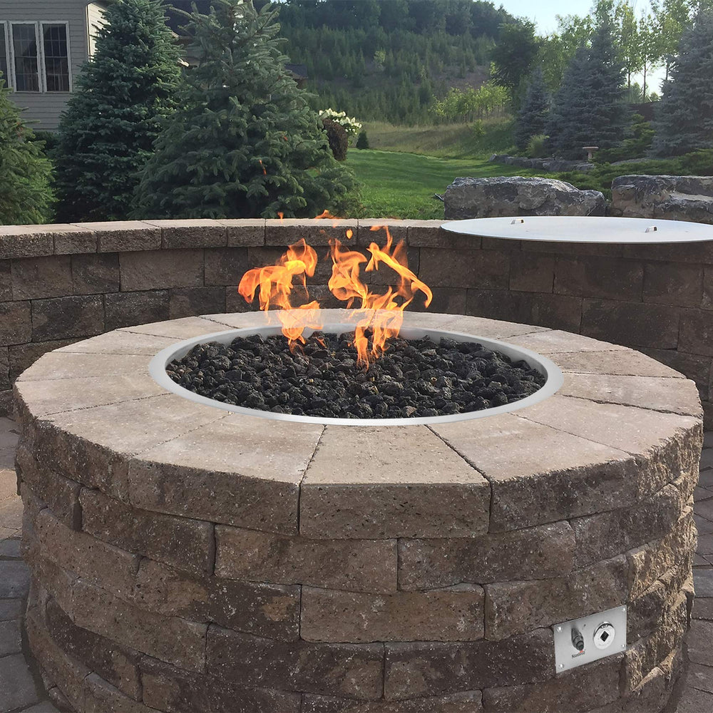 Stanbroil ignition kit installed in a backyard fire pit for quick starts