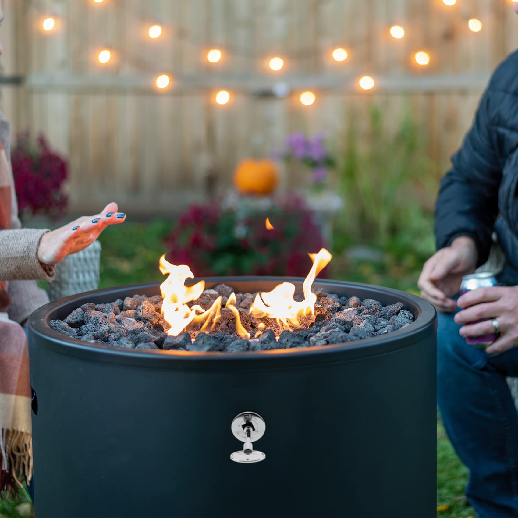 Stanbroil lifestyle backyard scene with fire pit showing warm atmosphere and entertaining benefit