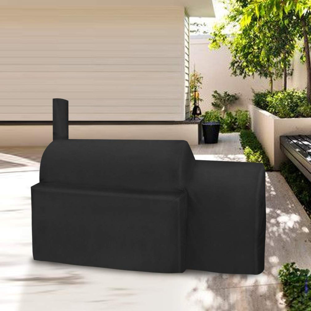 Stanbroil covered smoker in backyard showing weather protection benefit