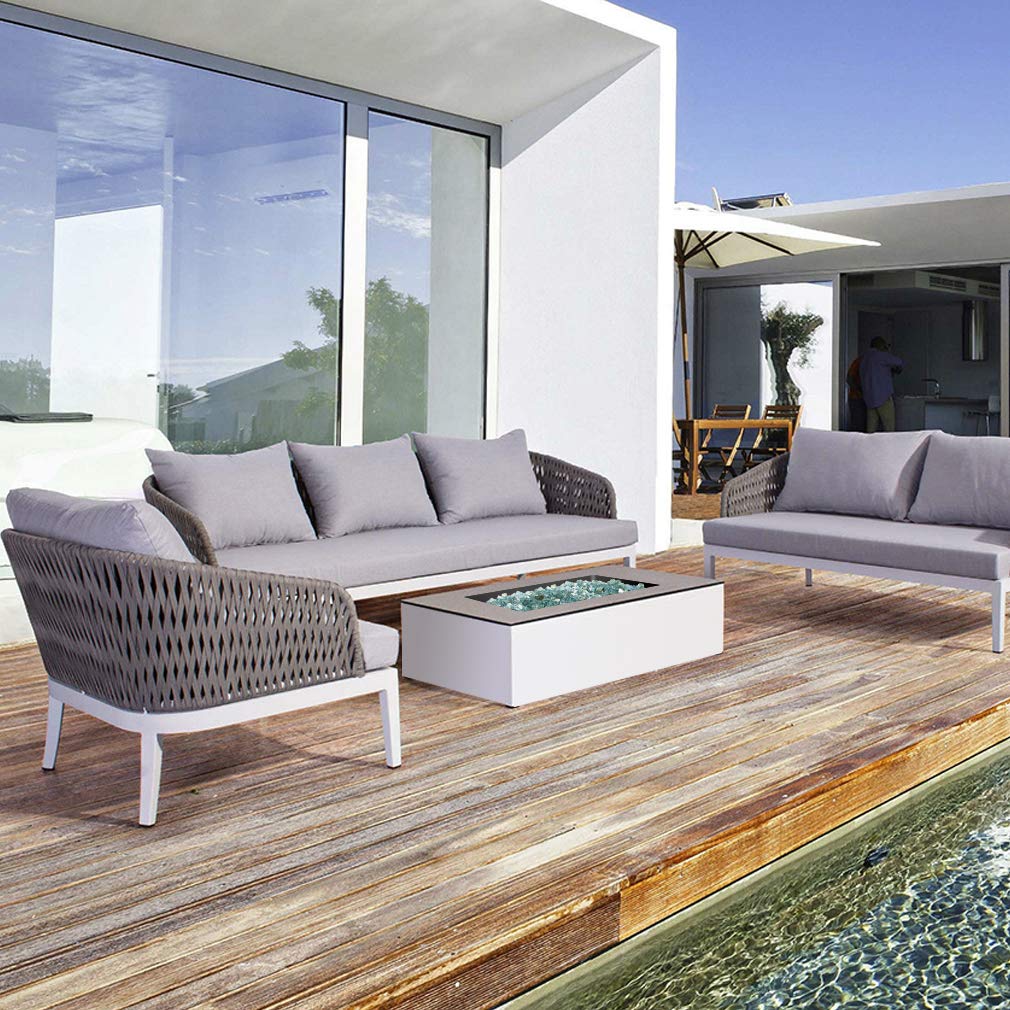 Outdoor patio fire bowl with Stanbroil aqua blue glass creating a modern ambiance