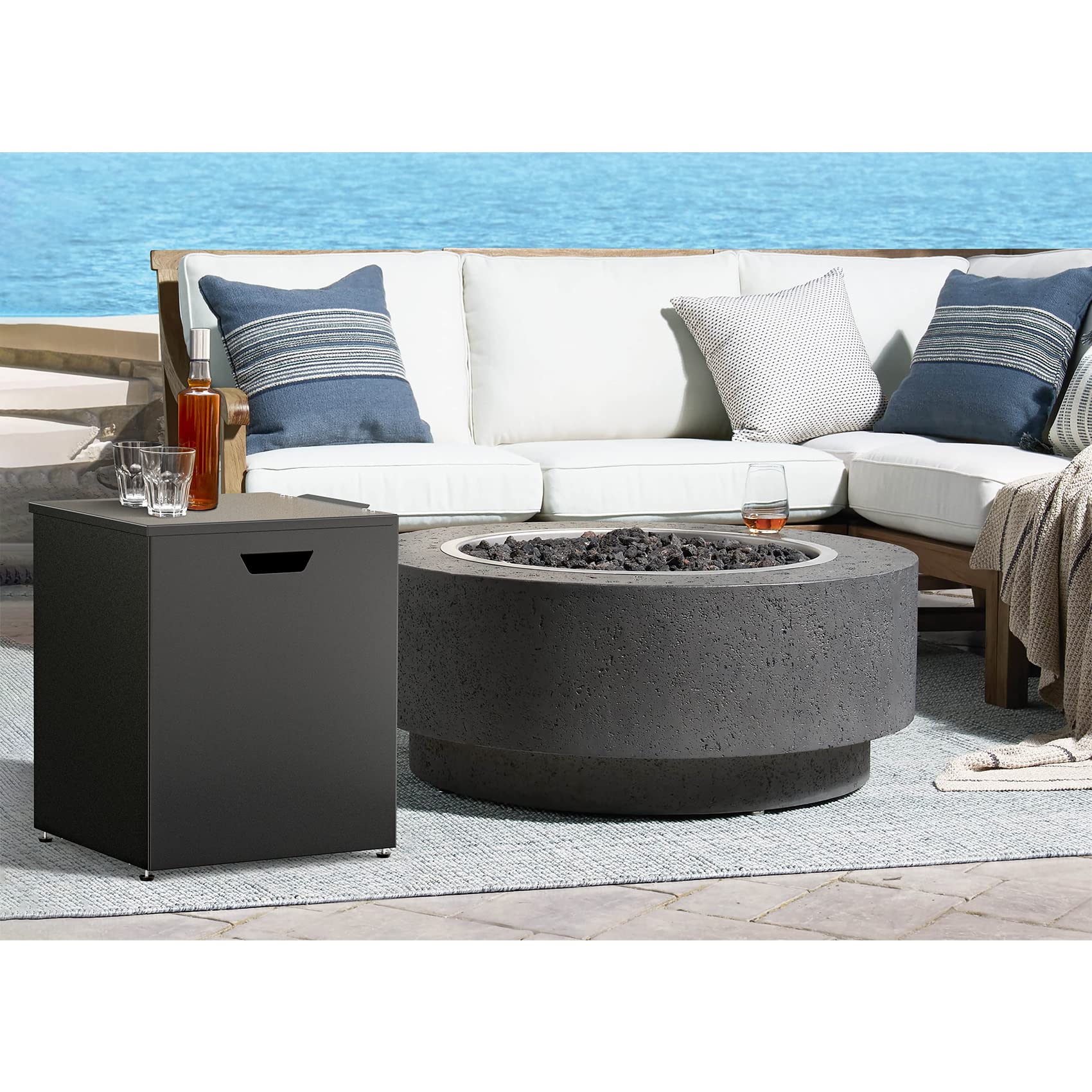 Stanbroil beside chair for scale demonstrating compact outdoor footprint