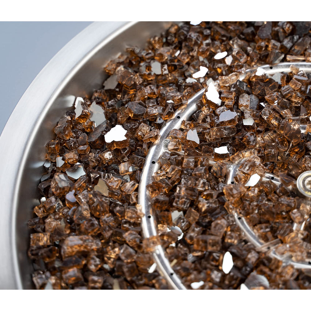 Stanbroil beads next to a measuring tape showing half-inch size for correct burner fit