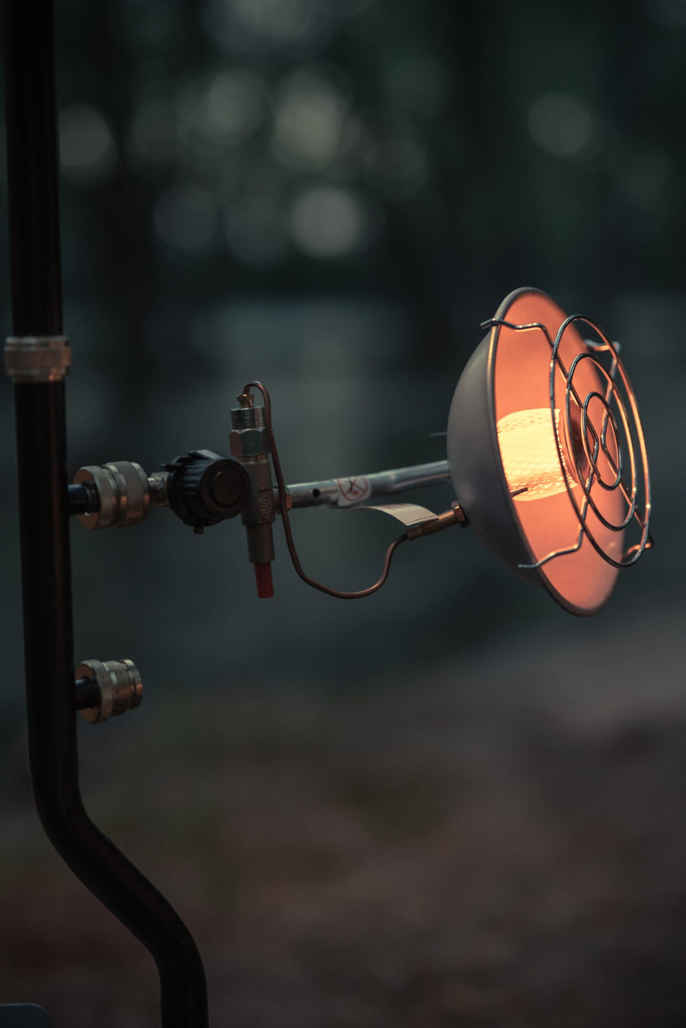 Stansport heater in a campsite creating focused warmth for campers and gear
