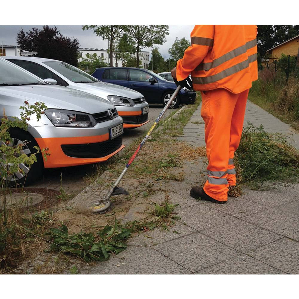 Stens cutting head trimming grass vertically as an edger for clean edges