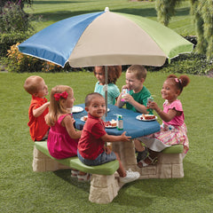 Step2 table in backyard demonstrating outdoor play and sun protection benefit