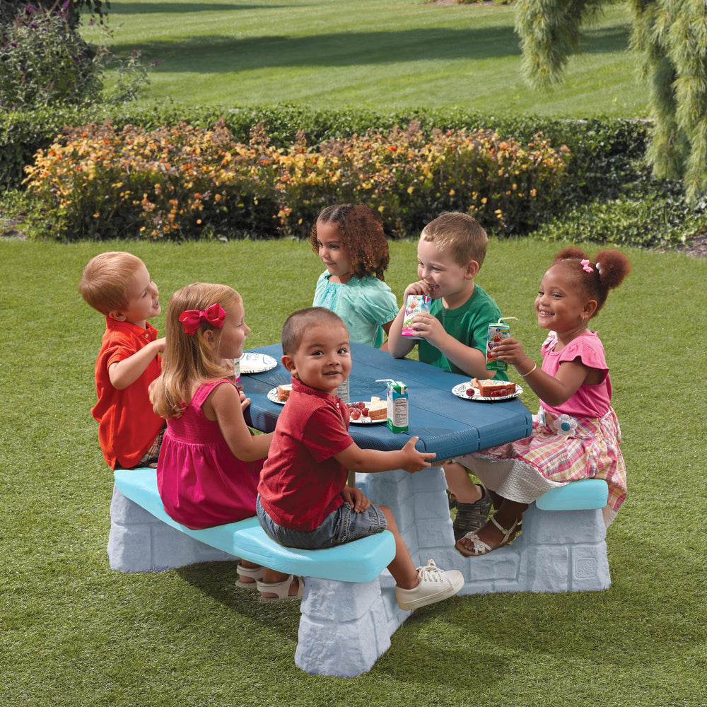 Step2 picnic table in backyard setting showing weather-resistant outdoor use