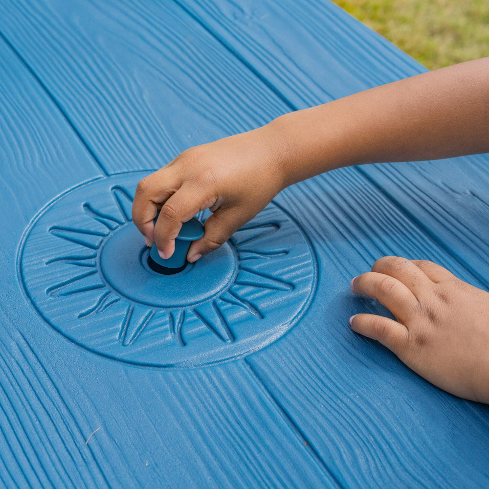 Step2 picnic table inside playroom showing removable umbrella and indoor versatility
