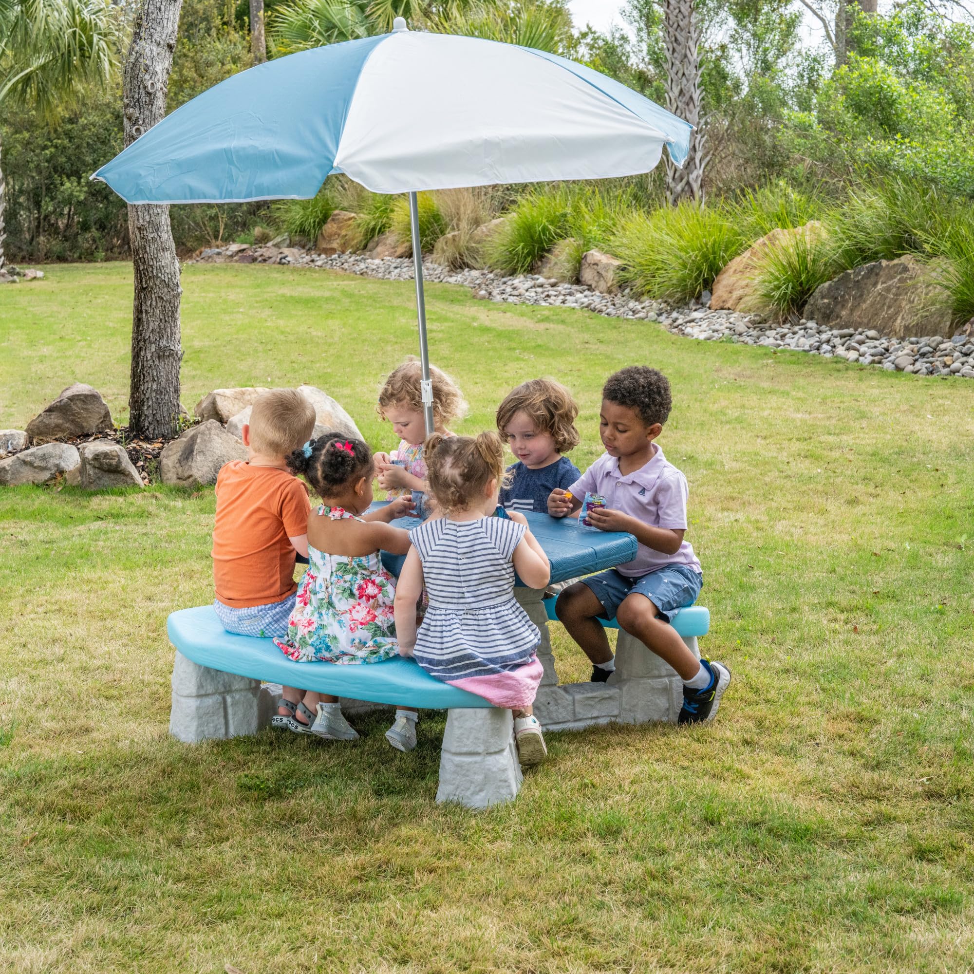 Step2 table next to child for scale showing compact footprint and kid-safe height