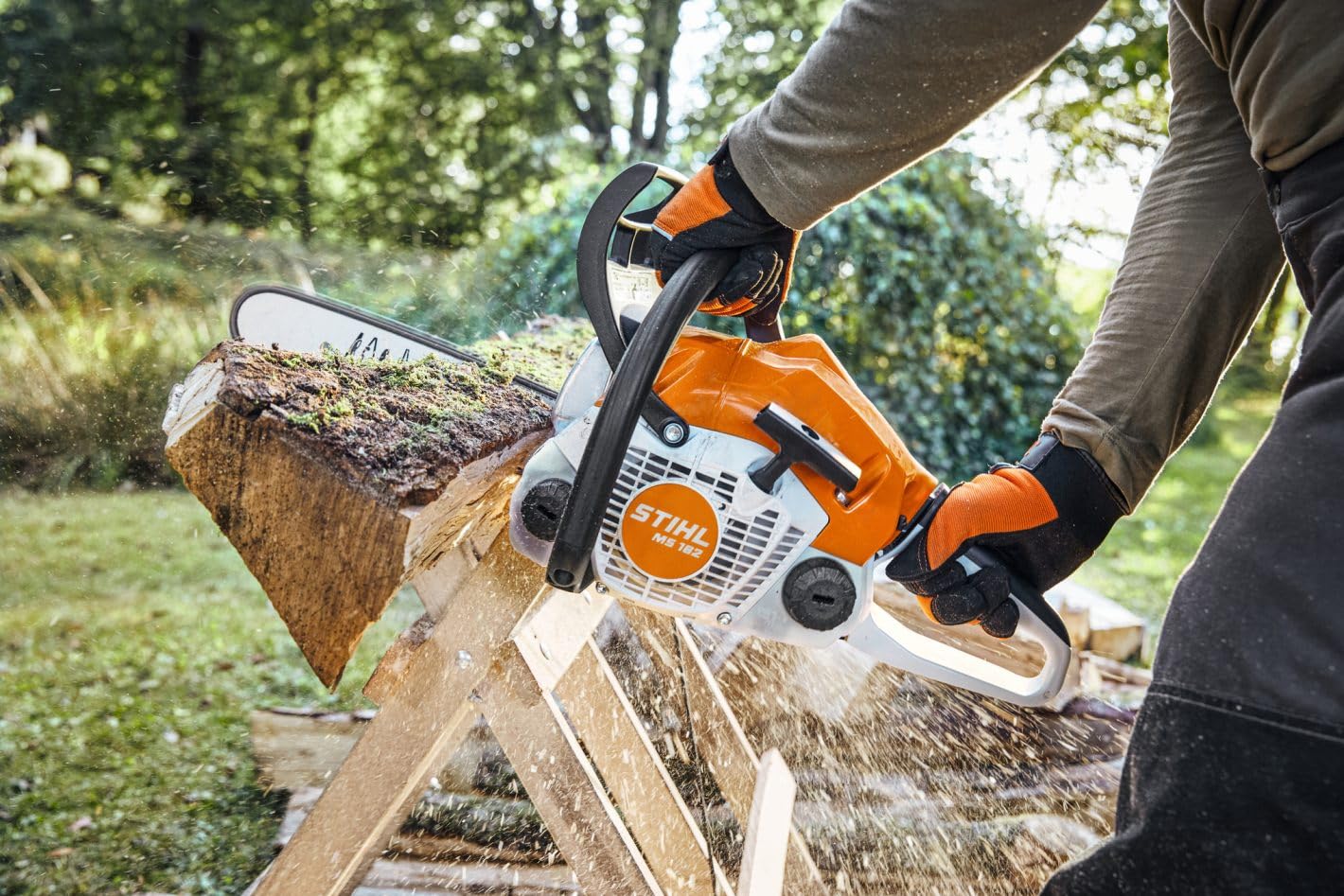 Stihl MS 162 cutting a branch, demonstrating maneuverability and precise control