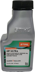 STIHL bottle on jobsite next to chainsaw demonstrating ready-to-use convenience