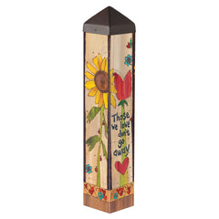 Studio M art pole front view showing full 20-inch decorative design and outdoor placement