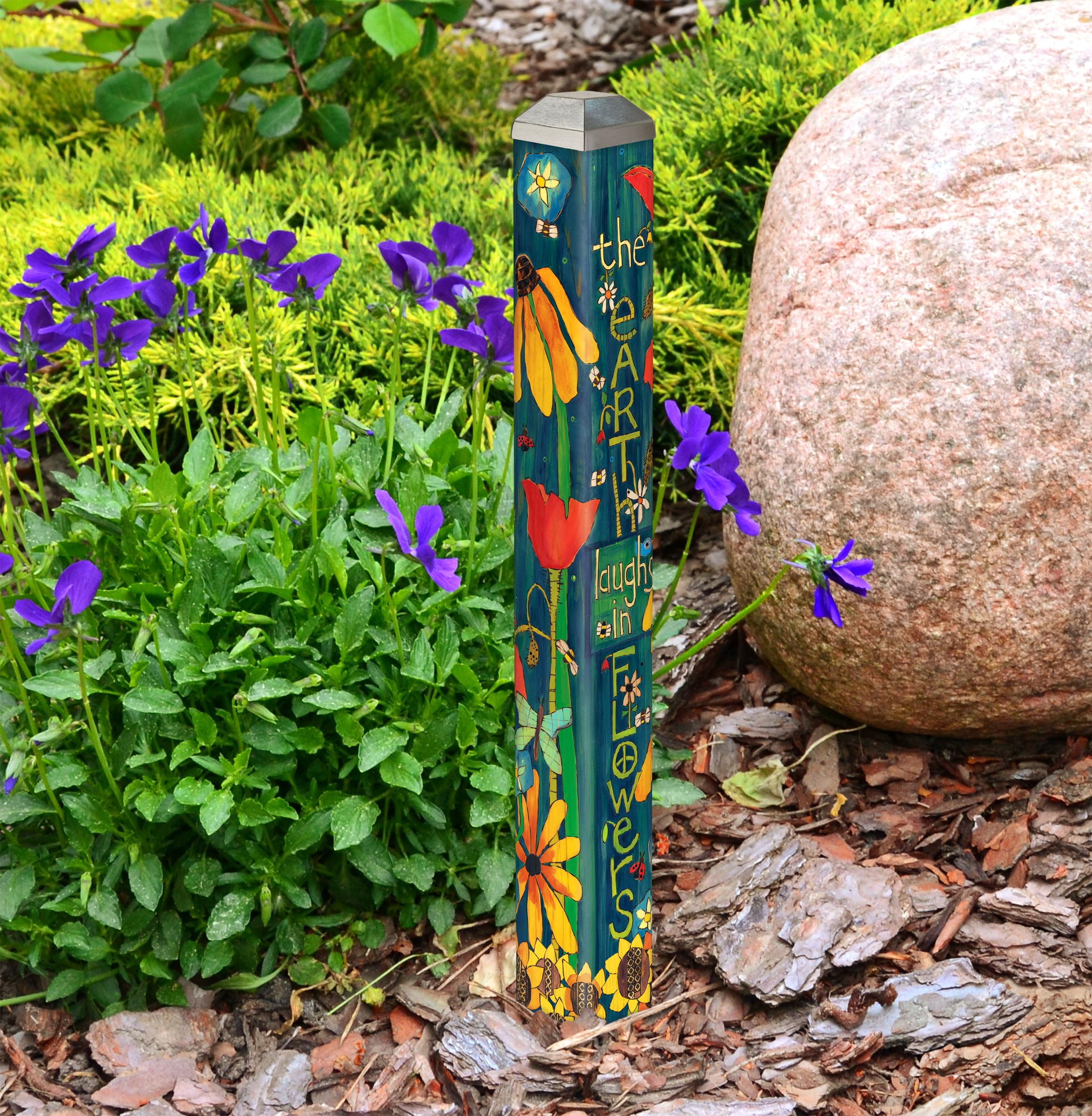 Studio M pole installed among plants adding color and low-profile decoration