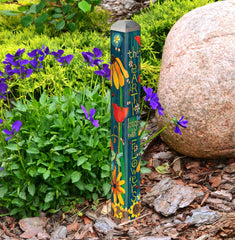 Studio M pole installed among plants adding color and low-profile decoration