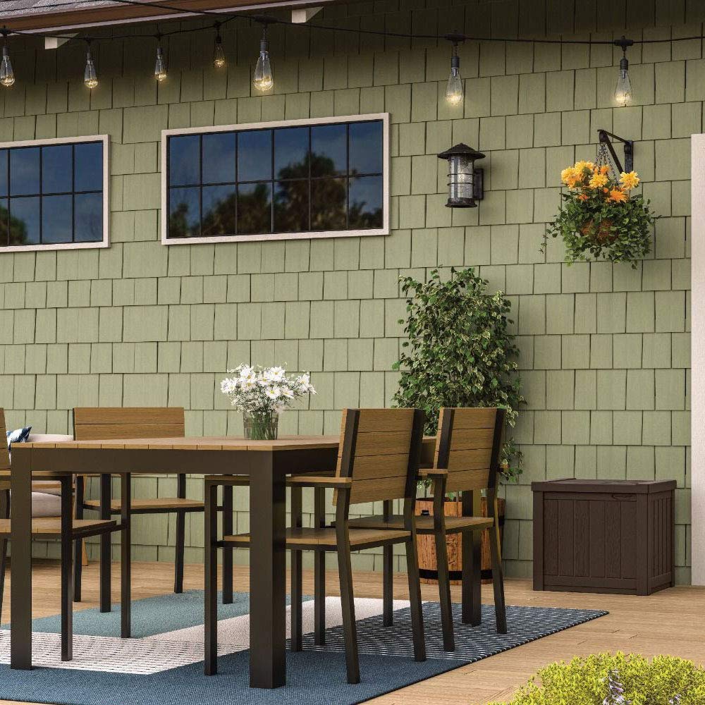 Suncast on balcony with decor showing stylish storage for small outdoor spaces