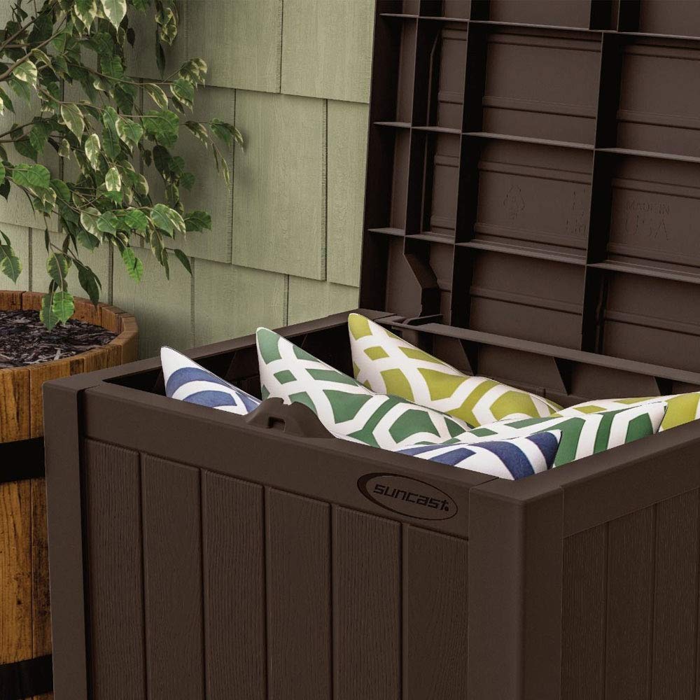 Suncast lid used as side table demonstrating extra seating and surface benefit