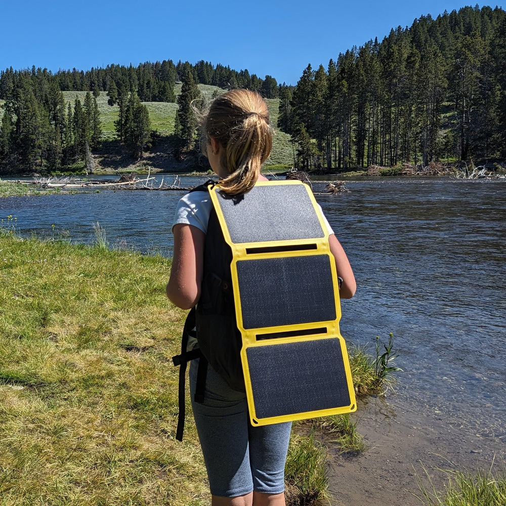 SunJack powering a phone outdoors providing on-the-go device charging