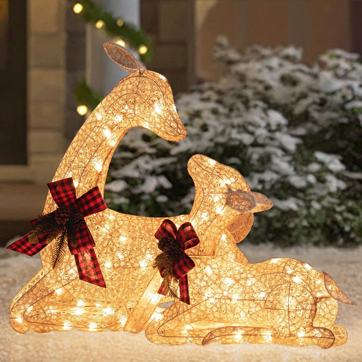 Sunjoy lying deer front view showing warm LED glow and festive pose