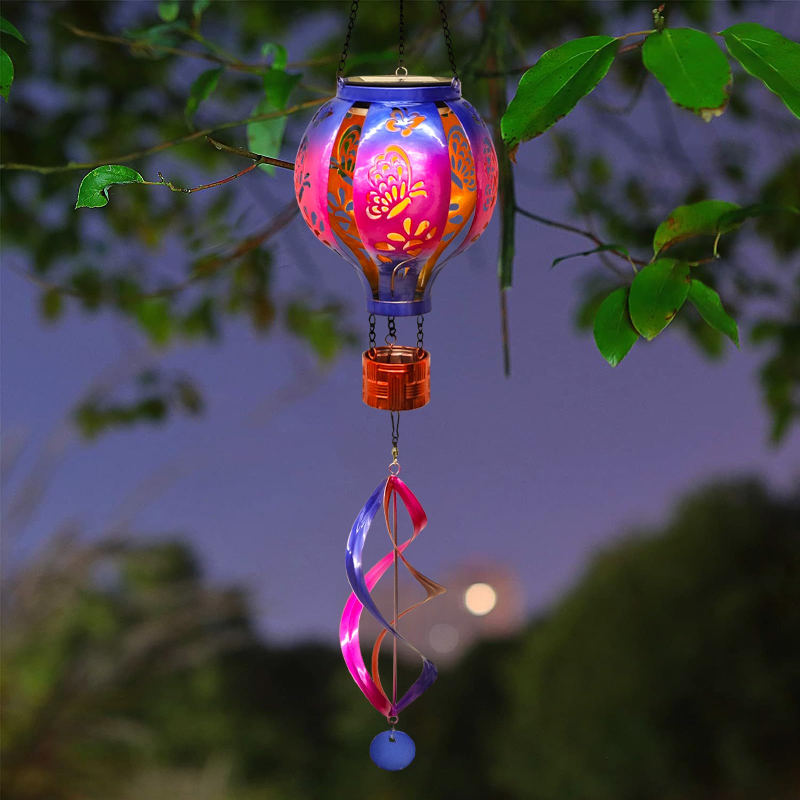 SUNNYPARK spinner in motion on patio demonstrating kinetic movement and evening glow
