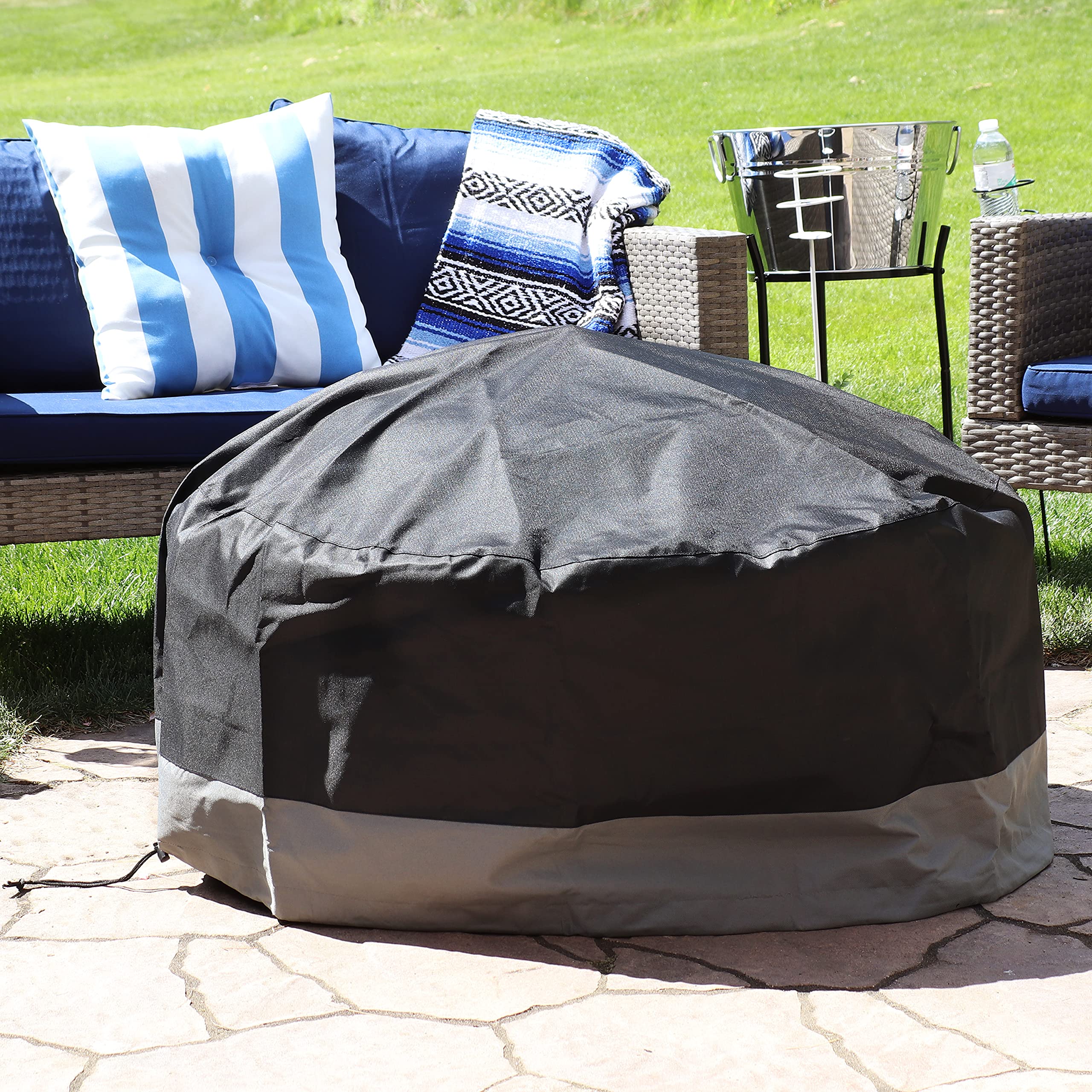Sunnydaze Decor covered fire pit in backyard keeps debris out
