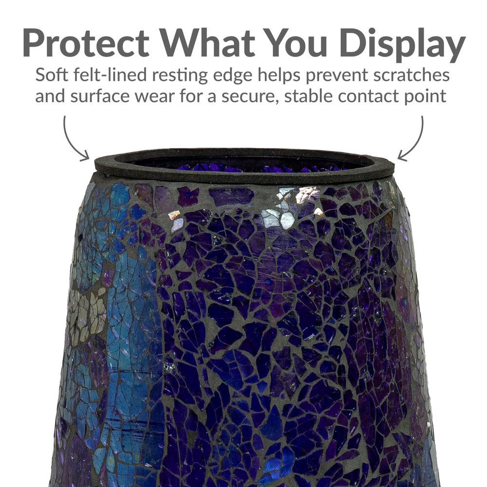 Sunnydaze Decor pedestal placed in garden bed adding color and reflective interest