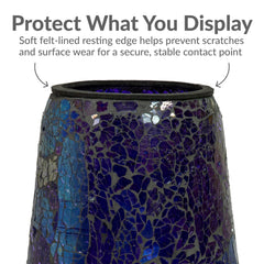 Sunnydaze Decor pedestal placed in garden bed adding color and reflective interest