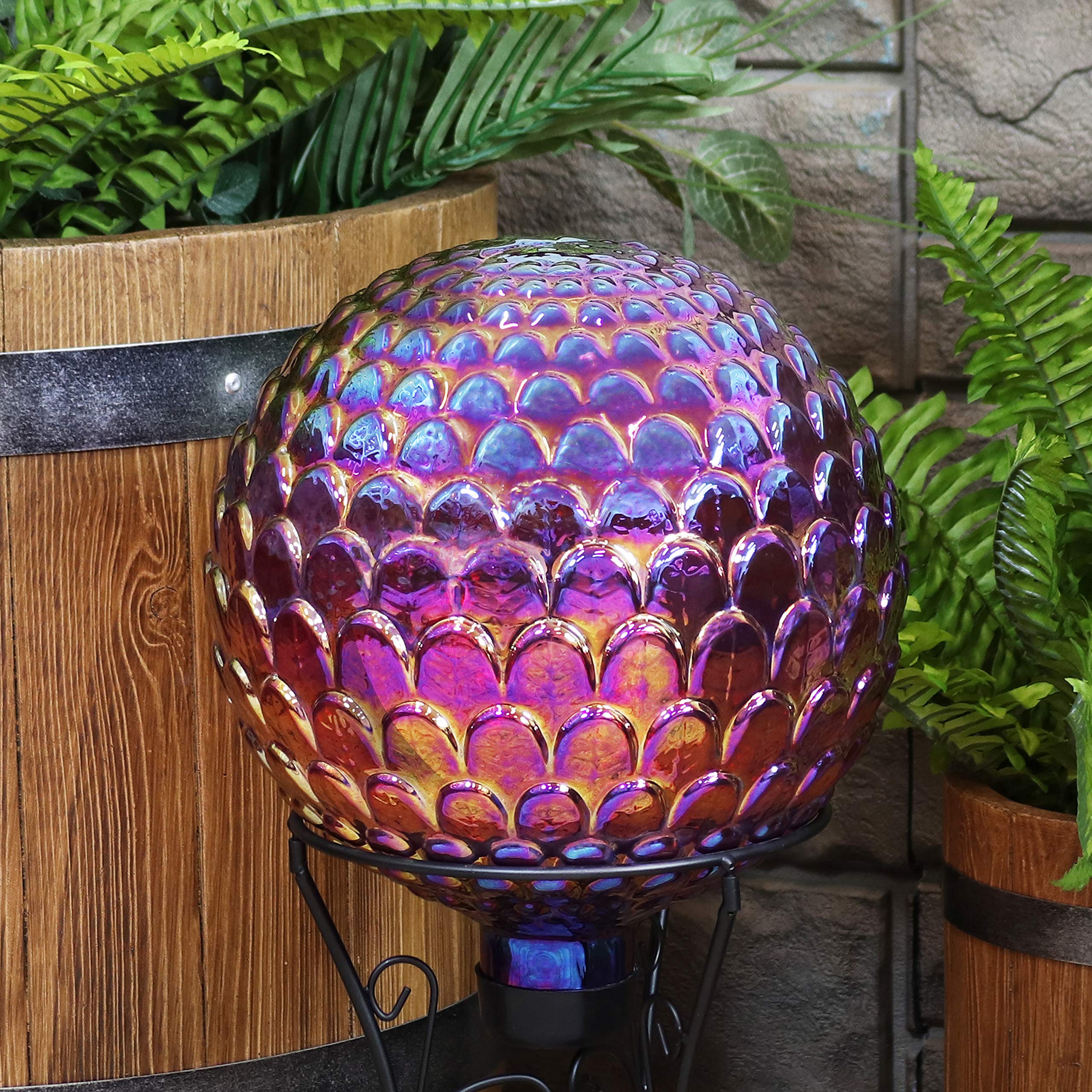 Sunnydaze gazing ball nestled in flower bed adding color and garden depth