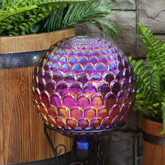 Sunnydaze gazing ball nestled in flower bed adding color and garden depth